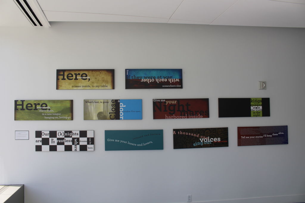 Art pieces hanging on the wall outside the Sorensen Center